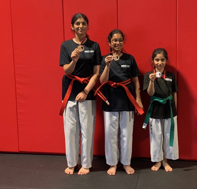 Woodbridge students showing Taekwon-Do medals
