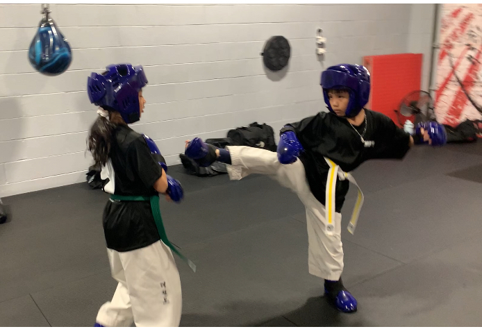 Kids practicing sparring at White Fang Taekwon-Do