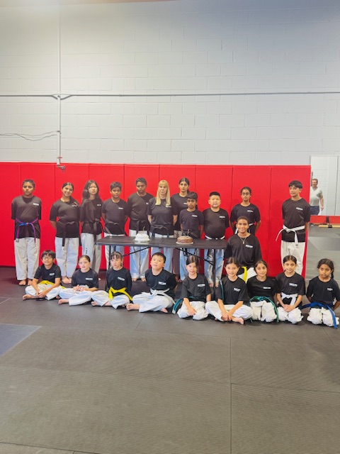 White Fang Taekwon-Do students and their instructor gathered together in Woodbridge