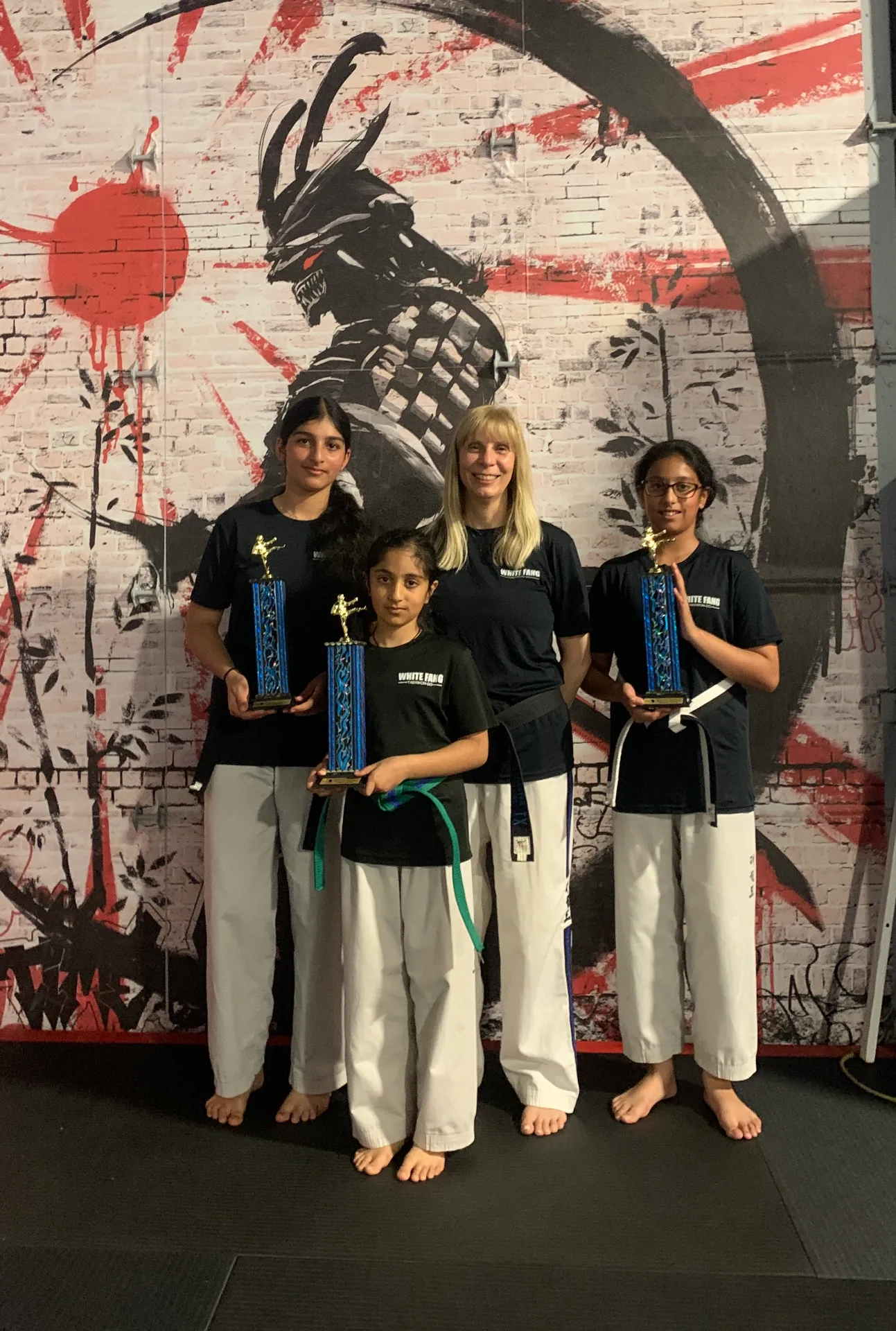 Kaler family students celebrating their trophies with Grandmaster Scarsellone in Woodbridge